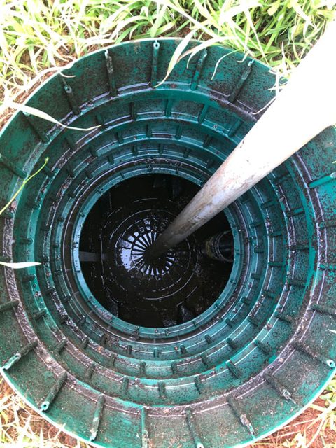 Stock photo of a septic tank riser and lid